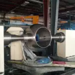 Industrial equipment showcasing a precision machined component, relevant to Eric Walper's expertise in IT solutions and technical projects at Clear Sailing IT Services.